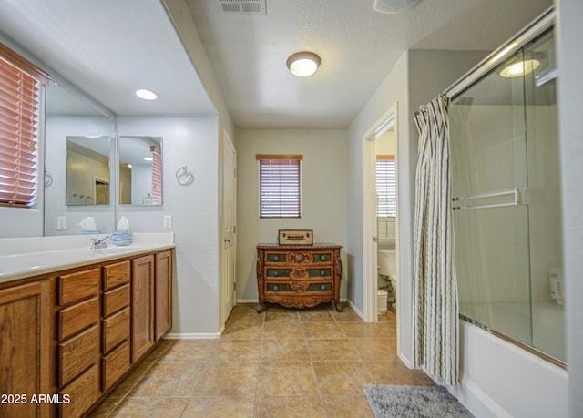 1786 S Seton Ave, Gilbert, AZ 85295 - bathroom featuring toilet, vanity, baseboards, enclosed tub / shower combo, and a textured ceiling