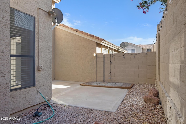 view of patio with fence