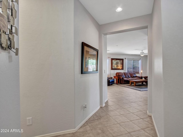 hallway featuring light tile patterned floors