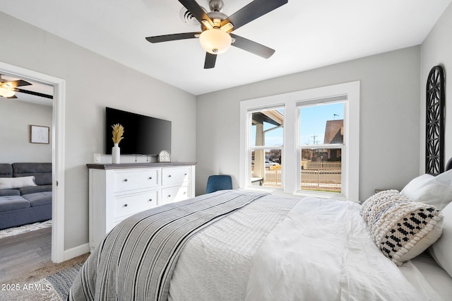 bedroom featuring baseboards and a ceiling fan