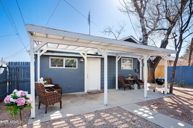 exterior space featuring a patio, fence, and a pergola