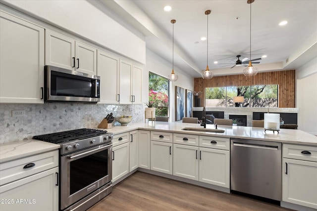 33667 N 71st Way, Scottsdale, AZ 85266 - kitchen with appliances with stainless steel finishes, a sink, tasteful backsplash, a ceiling fan, and recessed lighting