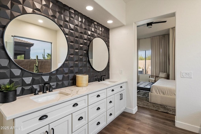 33667 N 71st Way, Scottsdale, AZ 85266 - ensuite bathroom with double vanity, baseboards, tasteful backsplash, wood finished floors, and recessed lighting