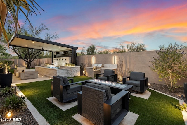 33667 N 71st Way, Scottsdale, AZ 85266 - patio terrace at dusk with an outdoor living space with a fire pit, a patio area, and a gazebo