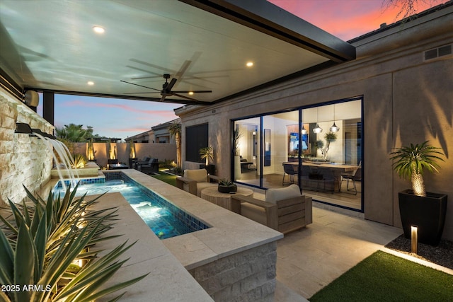 33667 N 71st Way, Scottsdale, AZ 85266 - pool at dusk with a ceiling fan, a fenced backyard, and a patio