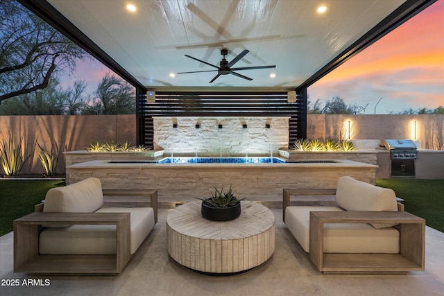 33667 N 71st Way, Scottsdale, AZ 85266 - patio terrace at dusk with ceiling fan, a fenced backyard, and a patio