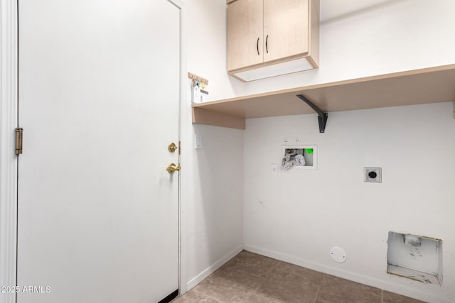 washroom with gas dryer hookup, cabinets, washer hookup, and electric dryer hookup