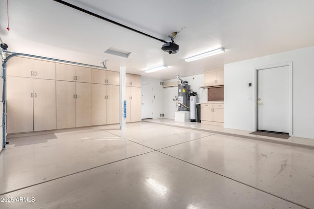 garage with a garage door opener and water heater