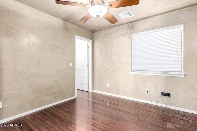 unfurnished room with dark hardwood / wood-style floors and ceiling fan