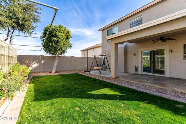 view of yard with a patio and ceiling fan