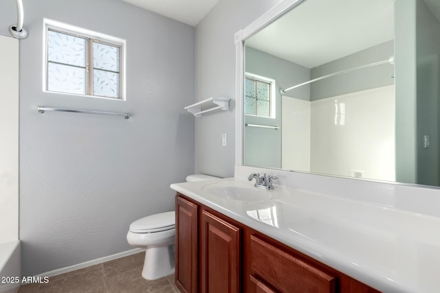 bathroom with vanity, tile patterned floors, and toilet