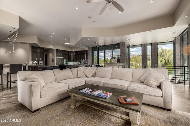 living room featuring recessed lighting and ceiling fan
