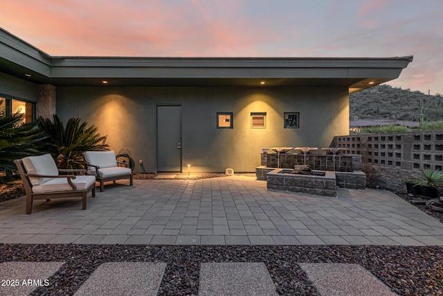 view of patio / terrace featuring an outdoor fire pit