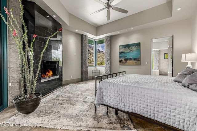 bedroom with recessed lighting, a fireplace, and baseboards