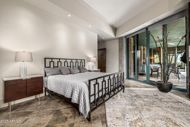 bedroom with recessed lighting, stone finish floor, access to exterior, and visible vents