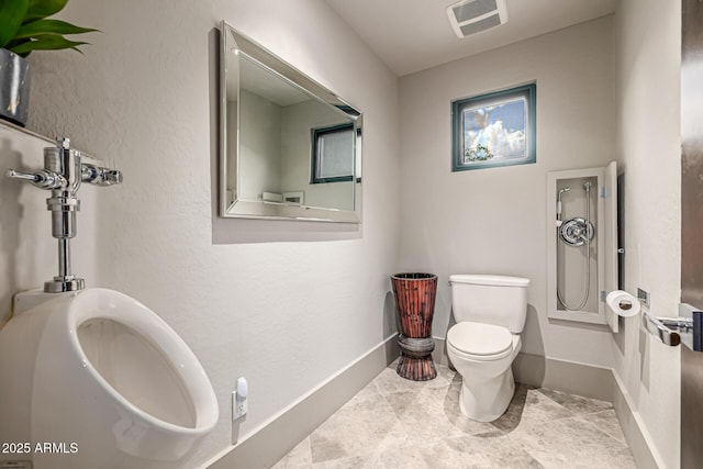 bathroom with visible vents, toilet, and baseboards