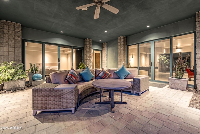 view of patio / terrace featuring a ceiling fan and an outdoor living space