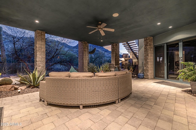 view of patio / terrace featuring outdoor lounge area, a ceiling fan, and fence