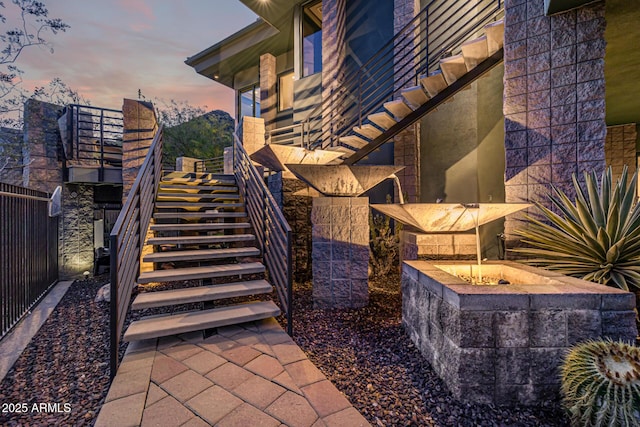 exterior space with stairway and fence