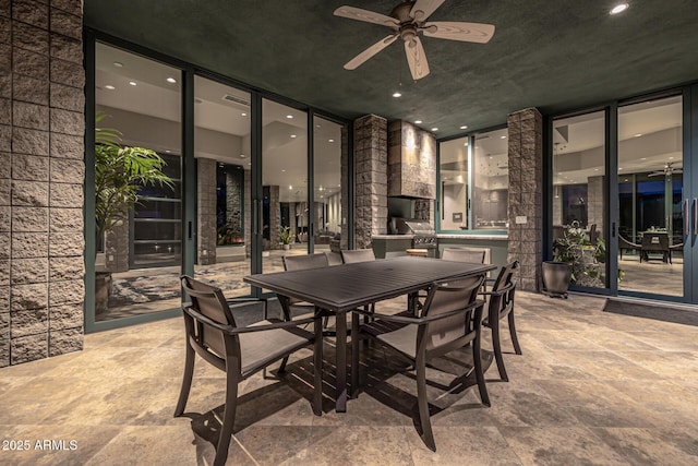 view of patio / terrace with a grill, outdoor dining space, and ceiling fan