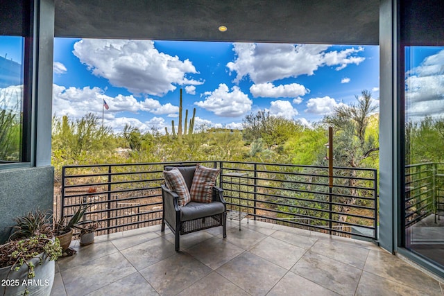 view of patio featuring a balcony