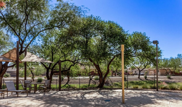 view of property's community featuring fence