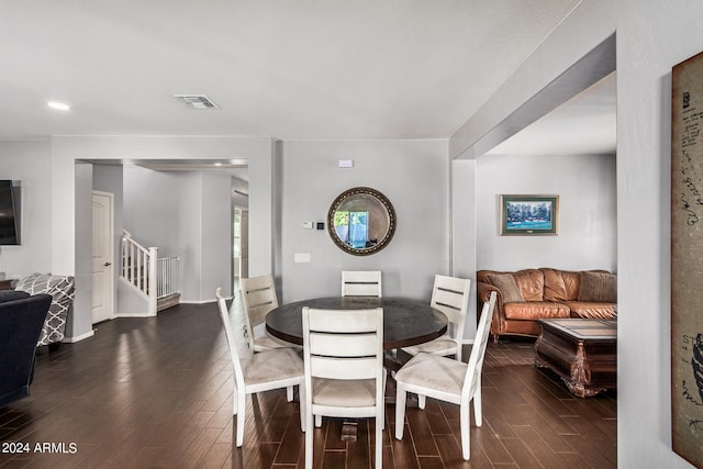 dining area featuring dark wood-type flooring