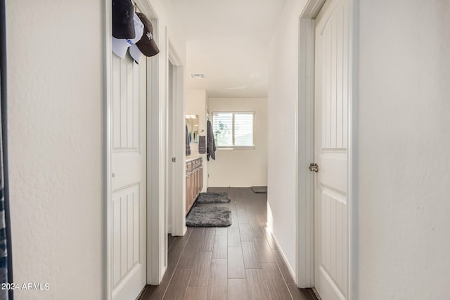 hall with dark wood-type flooring