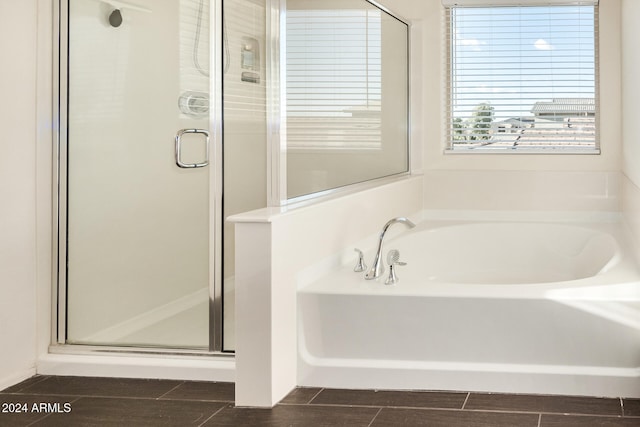 bathroom with shower with separate bathtub