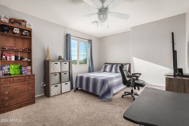 bedroom with ceiling fan and light carpet