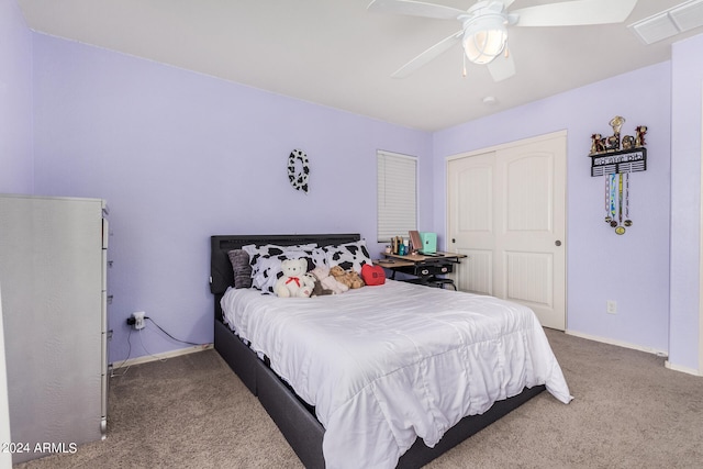 bedroom featuring ceiling fan, carpet floors, and a closet