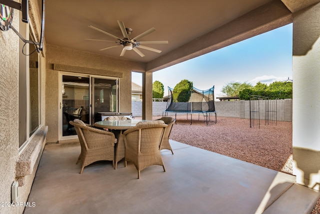 view of patio with a trampoline and ceiling fan