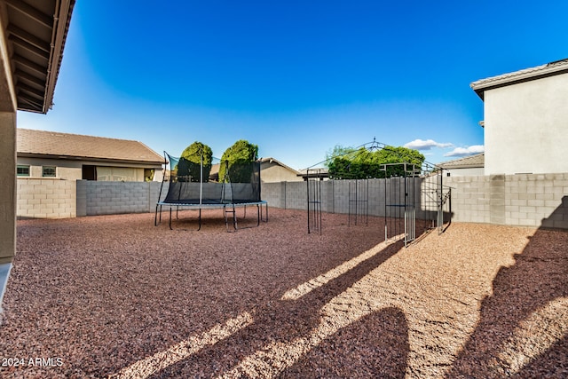 view of yard with a trampoline