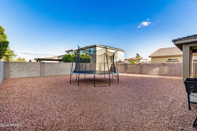 view of yard with a trampoline