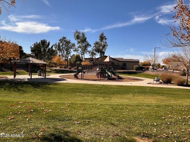 view of play area with a gazebo and a lawn