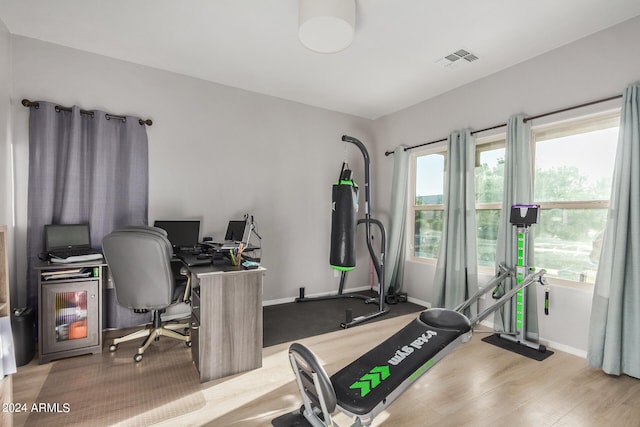 office space with light hardwood / wood-style flooring