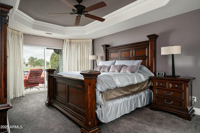 carpeted bedroom with access to exterior, visible vents, a tray ceiling, and ornamental molding