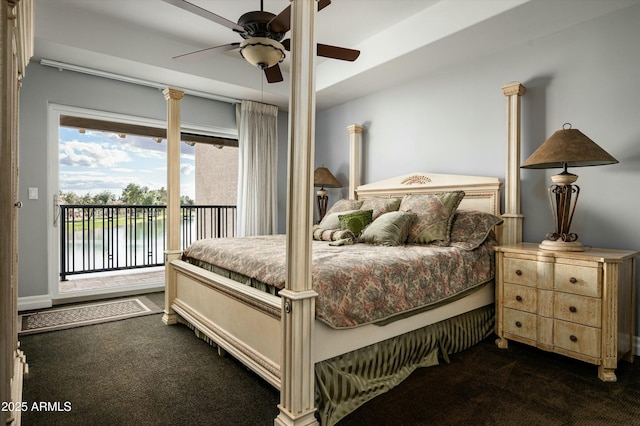 bedroom featuring dark colored carpet, a water view, ceiling fan, and access to outside