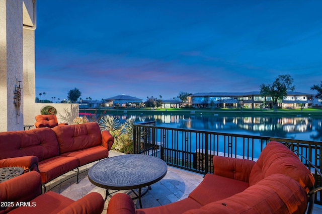 exterior space featuring an outdoor living space and a water view