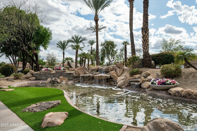 view of community featuring a lawn