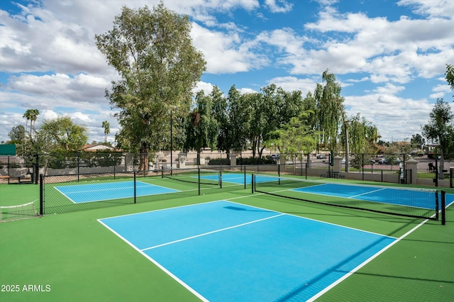 view of tennis court with fence