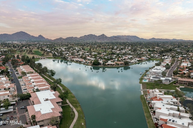 aerial view featuring a water and mountain view