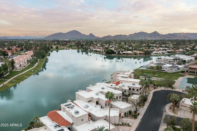 bird's eye view with a water and mountain view