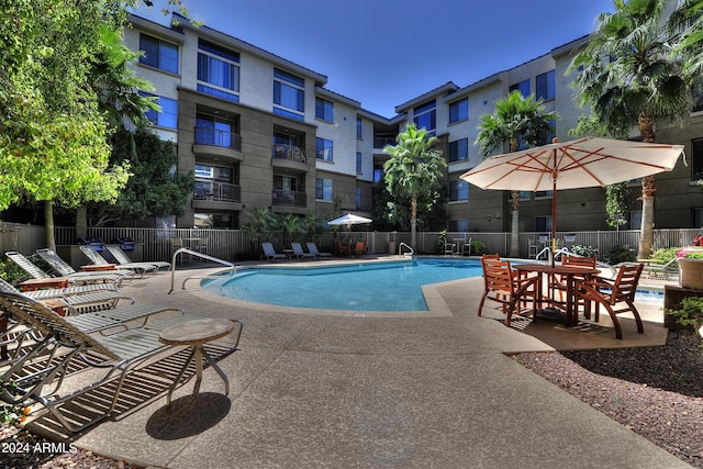 view of swimming pool with a patio area