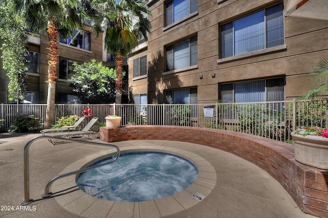 view of pool featuring a community hot tub