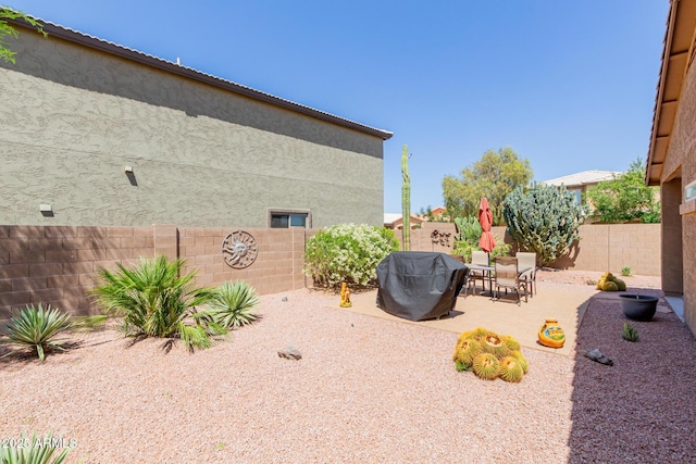 view of yard with a fenced backyard and a patio area