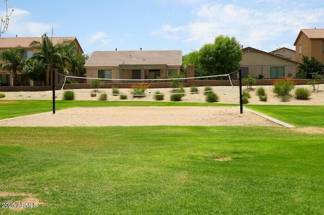 view of community featuring a yard and volleyball court
