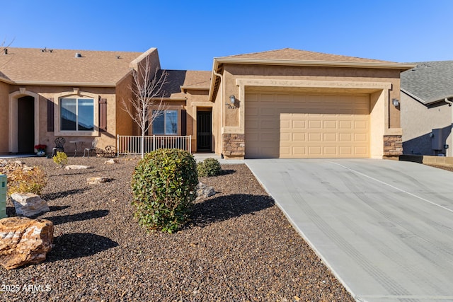 5524 N Brinson Ln, Prescott Valley, AZ 86314 - ranch-style house with concrete driveway, an attached garage, stucco siding, and stone siding