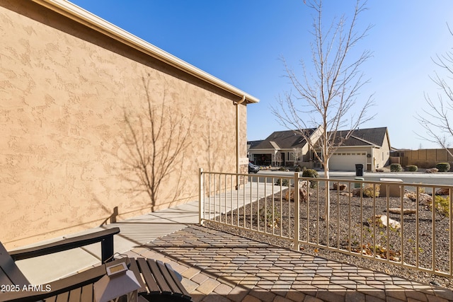 5524 N Brinson Ln, Prescott Valley, AZ 86314 - view of side of home with stucco siding, concrete driveway, and a garage