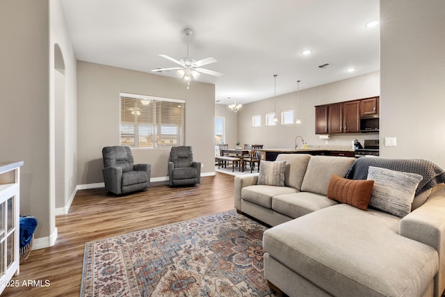 5524 N Brinson Ln, Prescott Valley, AZ 86314 - living area with a ceiling fan, light wood finished floors, baseboards, recessed lighting, and a chandelier